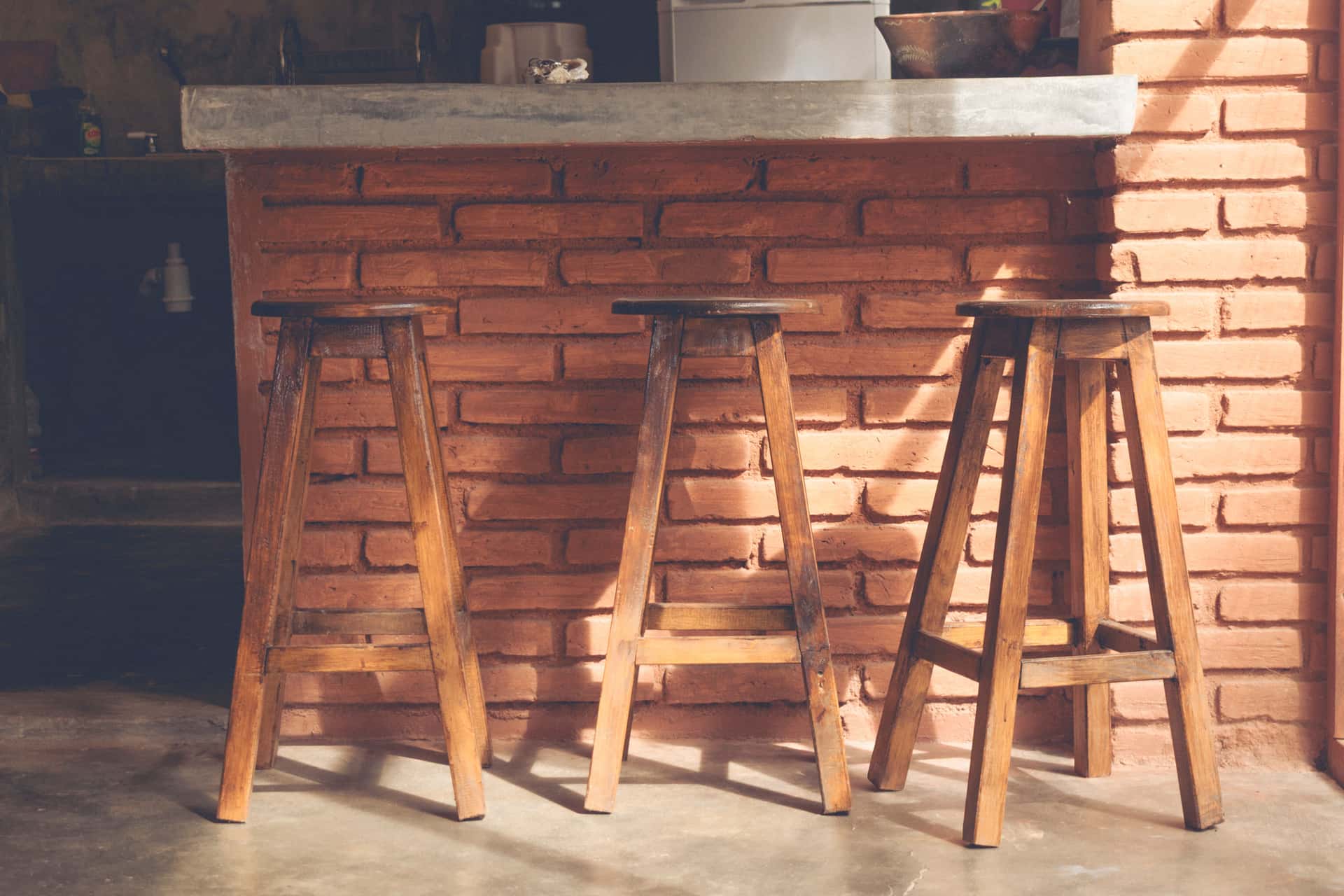 A saddle stool, a wobble stool and a flat stool side by side