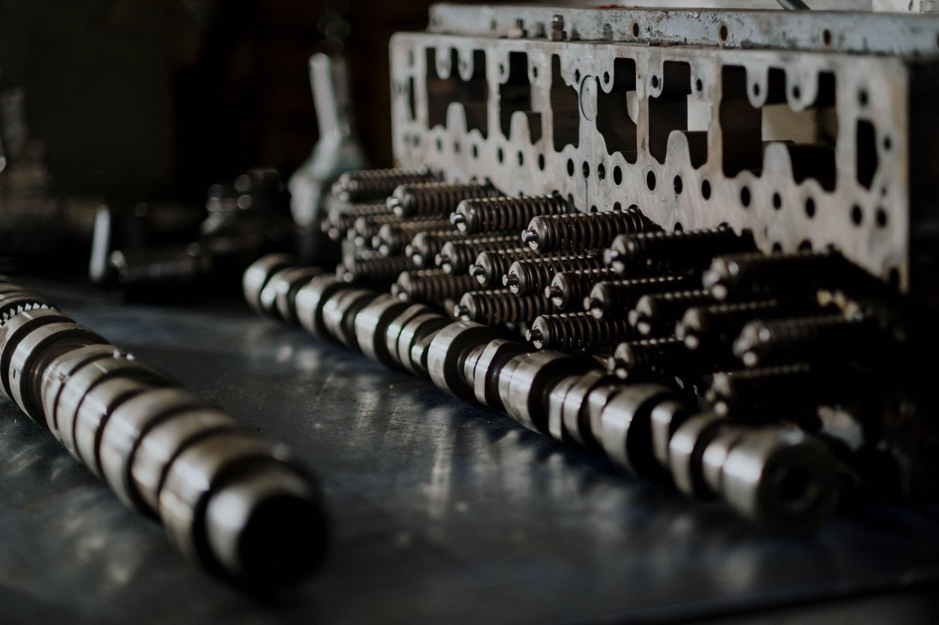 Mechanical components and springs laid out on a workbench