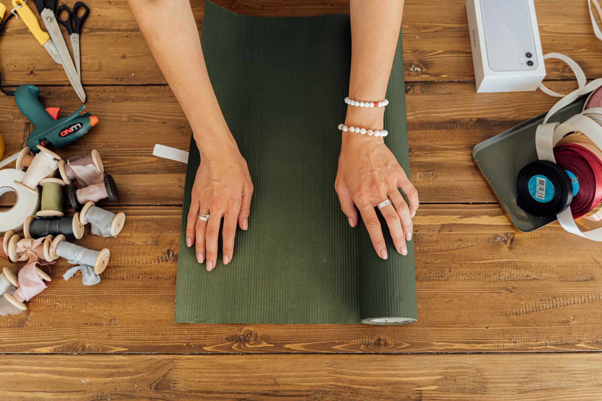 A footrest, a lumbar cushion and a standing mat arranged as gifts
